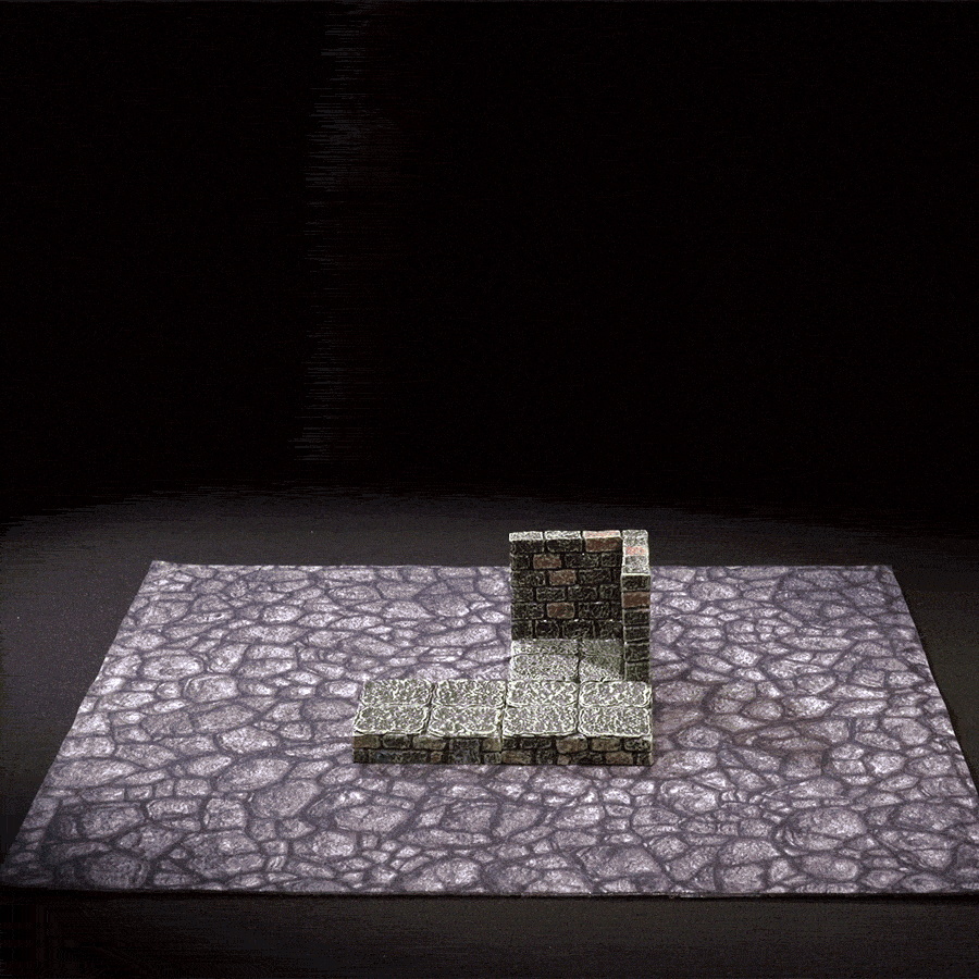 demonstration of the magnetic bottom of a dungeon floor being placed on a metal terrain tray and tilted at a 45 degree angle