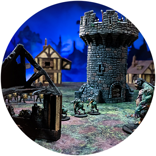 Charred tudor ruins and a small watchtower provide cover in this wargaming build