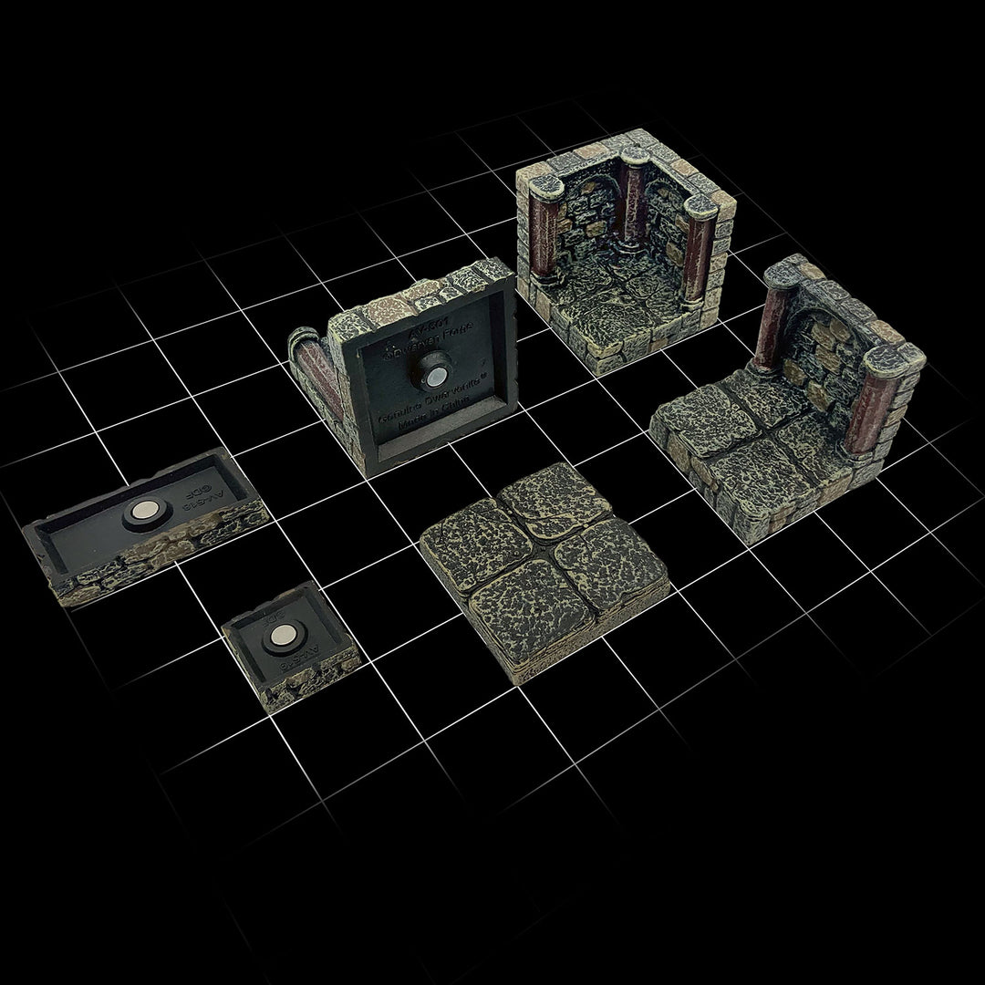 Six pieces laid over a 1 inch scale grid, illustrating how dungeon floor tiles have a natural-looking 1-inch grid carved into them. Also pictured are anchor magnets at the bottom of the floors tiles, used to anchor the pieces to our metal-backed terrain trays.