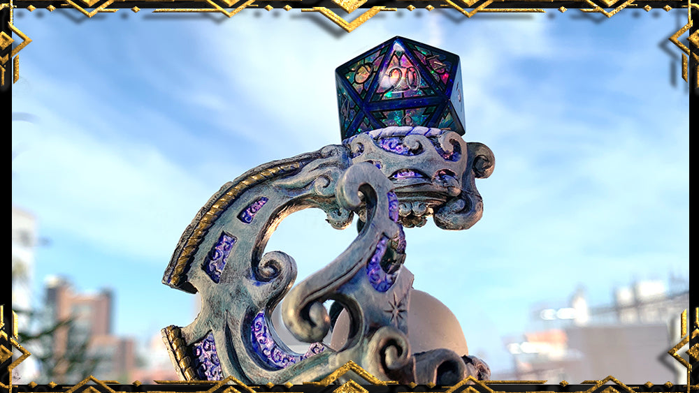 a naturally lit detail shot of the intricately sculpted Elven hero, the Mystic Crescent, with a stained glass style die atop it.