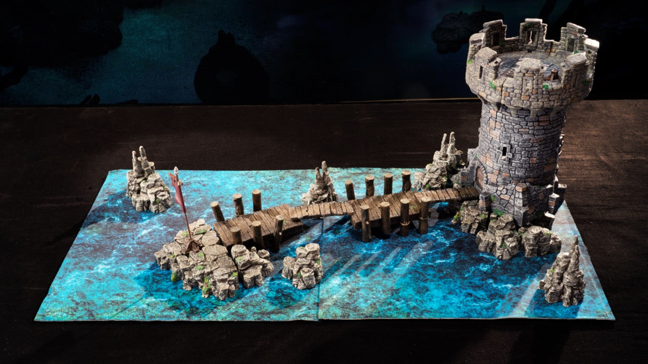 Three sets combined to make a wargaming battlefield. The castle watchtower sits at the end of our cavern docks surrounded by the scattered rocks of Erinthor mountain.